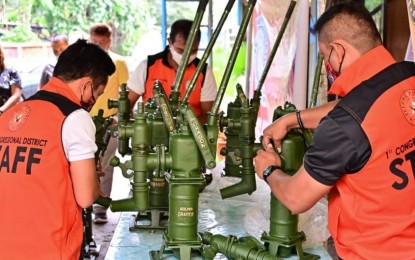 <p><strong>ADDITIONAL WATER SUPPLY.</strong> Staff members of Davao City 1st District Rep. Paolo 'Pulong' Duterte check the 20 units water pumps to be turned over to the barangay officials of Barangay Bago Aplaya in Talomo District, Davao City, on Wednesday (Oct. 7, 2020). The turnover came after the barangay officials signed a resolution underscoring the need for additional source of water for residents in the area.  <em>(Photo courtesy of Davao City 1st Dist. Rep. Paolo 'Pulong' Duterte's office)</em></p>