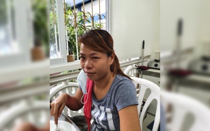 <p><strong>NABBED.</strong> Authorities arrest Catherine Tandas, a human trafficking suspect included in Aklan's most wanted list, in Navotas City on Wednesday (Oct. 7, 2020). Tandas has an outstanding warrant of arrest issued by Kalibo, Aklan Regional Trial Court Branch 7 in 2018 for charges of human trafficking with no bail recommended. <em>(Photo courtesy of PNP-AKG)</em></p>