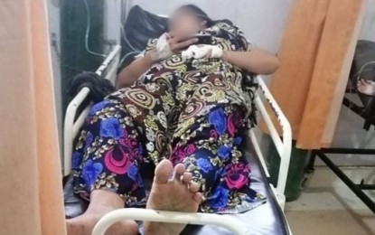 <p><strong>CARNAGE SURVIVOR.</strong> One of the four survivors in the carnage that took place on Friday (Oct. 9, 2020) in Barangay Lagunde, Pikit, North Cotabato, is treated for gunshot wounds at a local hospital after a group of armed men fired at their house. Four members of the family, all females that included a three-year-old, were killed during the shooting. <em>(Photo courtesy of Jess M. Ali – DXMY-RMN Cotabato)</em></p>
