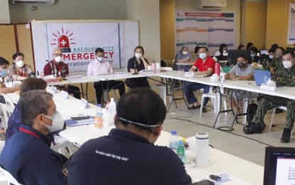 <p><strong>COVID-19 MEETING.</strong> Retired Maj. Gen. Melquiades Feliciano (front, 2nd from left) deputy chief implementer of Inter-Agency Task Force-Visayas, presides over the meeting of the Bacolod City Emergency Operations Center at the MassKara Hall of the Government Center on Monday (Oct. 12, 2020). He urged Bacolodnons with symptoms of coronavirus disease 2019 (Covid-19) to avail of free consultation and swab test.<em> (Photo courtesy of Bacolod City PIO)</em></p>