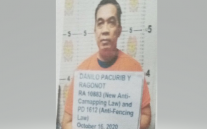 <p><strong>DRIVING STOLEN CAR</strong>. Police arrest M/Sgt. Danilo R. Pacurib of Quezon City Police District for driving a stolen vehicle on his way to work on Oct. 16, 2020. National Capital Region Police chief Maj. Gen. Debold Sinas ordered his immediate relief. <em>(NCRPO photo)</em></p>