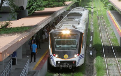 <p><strong>RAILROAD to PROGRESS.</strong> A Philippine National Railways train stops at a station in this undated photo. Bicol Saro Part-list Rep. Brian Raymund Yamsuan on Monday (Sept. 25, 2023) said President Ferdinand R. Marcos Jr.’s plan to issue an executive order (EO) that would fast-track the processing of licenses, permits and other requirements for infrastructure flagship projects would help expedite the revival of the Bicol Express, the once-famed PNR line that ran from Manila to Bicol. <em>(PNA file photo)</em></p>