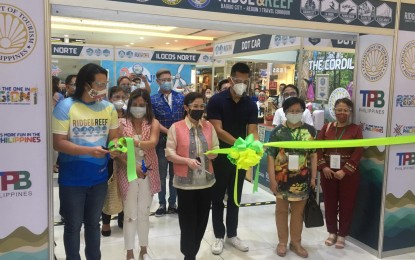 <p><strong>'RIDGE TO REEF'.</strong> Tourism Sec. Bernadette Romulo-Puyat attends the mini-trade fair participated by local entrepreneurs from Baguio City and the four provinces in Region 1 on Tuesday (Oct. 20) at the Robinsons Mall in San Nicolas, Ilocos Norte. Puyat is in Ilocos Norte to support the Region 1 tourism convention where the corridor plan between Baguio and the provinces of La Union, Pangasinan, Ilocos Sur, and Ilocos Norte is formally launched. <em>(PNA photo by Leilanie Adriano)</em></p>