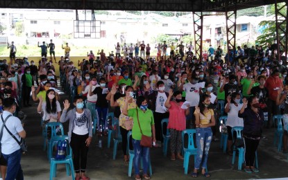 <p><strong>OATH OF ALLEGIANCE</strong>. A total of 451 Kadamay militant group members take their oath of allegiance to the government and denounce their support to the communist terrorist group in a ceremony held on Thursday (Oct. 22, 2020) in Barangay Mapulang Lupa, Pandi, Bulacan. They comprised the second batch of returnees from Kadamay who voluntarily surrendered and expressed support to the government.<em> (Photo by Manny Balbin)</em></p>