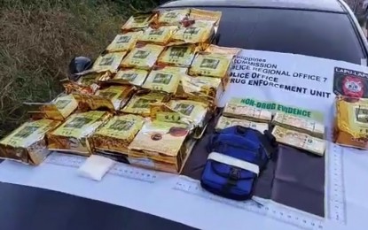 <p><strong>BIGGEST HAUL.</strong> The 22 packs of shabu seized from suspect Gilbert Lumanog, a resident of Poblacion, Pinamungajan, Cebu, listed as a high-value individual in Region 7, are displayed for inventory after the biggest haul in Lapu-Lapu City on late Wednesday (Oct. 21, 2020). Police Regional Office-7 Director, Brig. Gen. Albert Ignatius Ferro, on Thursday (Oct. 22, 2020) says the police is now pursuing other members of the Titing Laureciana Drug Group. <em>(Screengrab from Lapu-Lapu City Hall PIO video)</em></p>