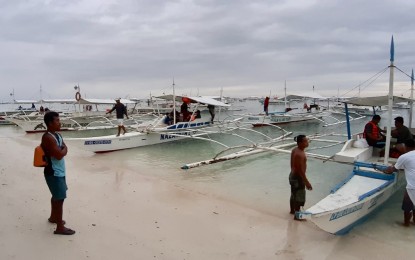 <p><strong>TOP ISLANDS IN ASIA AWARD.</strong> Undated photo shows boatmen preparing to bring tourists for island hopping at the Panglao Island's Alona beach. Presidential Assistant for the Visayas Secretary Michael Lloyd Dino on Thursday (Oct. 22, 2020) said the Condé Nast Traveler's (CNT) 2020 Readers' Choice Awards recognizing the islands in Cebu and the Visayas as Top Islands in Asia, is a good platform for recovery of the ailing tourism industry amid the Covid-19 pandemic. <em>(PNA photo by John Rey Saavedra)</em></p>