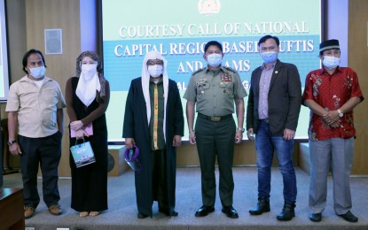 <p><strong>MEETING WITH MUSLIM LEADERS.</strong> AFP chief-of-staff Gen. Gilbert Gapay (3rd from right) poses for a photo opportunity with muftis, imams, and madrasah (Islamic schools) officials in a meeting in Camp Aguinaldo, Quezon City on Monday (Oct. 26, 2020). The meeting is part of the AFP's partnerships with imams and Muslim organizations in preventing and countering violent extremism and programs that give emphasis on stakeholder engagements and local government participation.<em> (Photo courtesy of AFP Public Affairs Office)</em></p>