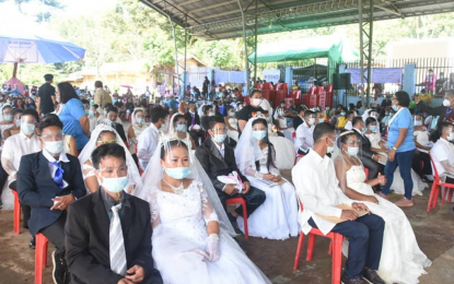 <p><strong>LOVE CONQUERS ALL.</strong> At least 32 couples tie the knot during a mass wedding administered by Antipas, North Cotabato, officials on Thursday (Oct. 29, 2020). Six of the grooms are former New People’s Army rebels who were convinced by their partners to surrender to the government. <em>(Photo courtesy of Antipas LGU)</em></p>