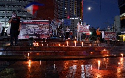 <p><strong>ANTI-COMMUNISM VIGIL.</strong> Candles are lit on the steps of the Boys Scout Circle Monument on Timog Avenue, Quezon City during a candle-lighting vigil on Thursday (Oct. 29, 2020). Anti-communist group, League of Parents of the Philippines, decried the recruitment activities of leftist groups and atrocities of the Communist Party of the Philippines-New People's Army-National Democratic Front. <em>(PNA photo by Robert Oswald P. Alfiler)</em></p>
