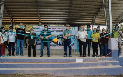 <p><strong>TURNOVER</strong>. Engineer Reynaldo Anfone, provincial agrarian reform project officer (center right), and Mayor Armando Quibod (center left) lead the ceremonial cutting of the ribbon of the PHP7-million water system project with some employees and Sta. Filomena village councilmen on Friday (Oct. 30, 2020). At least 300 households from the remote village and adjacent areas are expected to benefit from the project. <em>(Photo courtesy of Makilala LGU)</em></p>