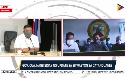<p><strong>TYPHOON DEVASTATION</strong>. Catanduanes Governor Joseph Cua speaks with Presidential Spokesperson Harry Roque during a virtual briefing aired over the People's Television Network on Monday (Nov. 2, 2020). Cua said Typhoon Rolly left five people dead and four injured as it flattened at least 13,000 houses along the coastline of Catanduanes on Sunday. <em>(Screenshot from PTV briefing by Connie Calipay)</em></p>