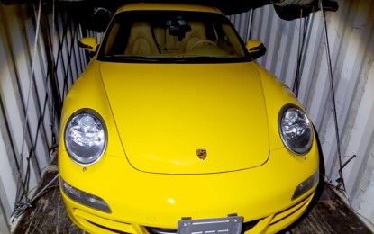 <p><strong>SEIZED.</strong> A yellow Porsche Sportscar is among the secondhand high-end vehicles seized by officers of the Bureau of Customs (BOC) at the Manila International Container Port (MICP) on Oct. 20, 2020. The BOC on Monday (Nov. 2, 2020) said the shipment was initially declared as furniture but contains four high-end vehicles upon verification. <em>(Photo courtesy of BOC)</em></p>