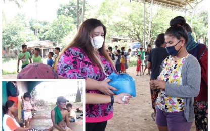 <p><strong>RELIEF AID.</strong> Vice Mayor Cheryl Valdevieso-Catamco of Matalam, North Cotabato (center), hands over a pack of relief goods to one of 200 evacuees before they returned home Monday (Nov. 2, 2020) in Arakan village. The villagers (inset) fled their homes since Oct. 24 following sporadic clashes between government troopers and the communist New People’s Army rebels. <em>(Photo courtesy of 603rd IBde)</em></p>