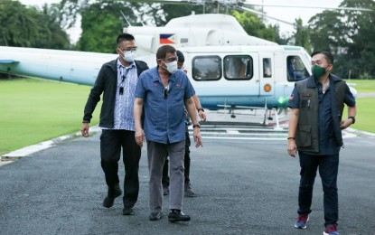 <p><strong>HEALTHY</strong>. President Rodrigo Roa Duterte is accompanied by Senator Christopher "Bong" Go as he arrives at the Malacañang Golf (Malago) Clubhouse after conducting an aerial inspection of areas hardest hit by Typhoon Rolly in the Bicol and Calabarzon regions on Nov. 2, 2020. Malacañang said on Tuesday (Nov. 3) that Duterte’s health is “as good as anyone of his age”, quashing speculations that the President’s absence in the initial government briefings on its response to super Typhoon Rolly was due to any health condition. <em>(Presidential photo by Simeon Celi)</em></p>