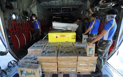<p><strong>RELIEF FOR 'ROLLY' VICTIMS.</strong> Philippine Air Force troops unload relief supplies for victims of Super Typhoon Rolly in the provinces of Albay and Catanduanes on Tuesday (Nov. 3, 2020). These include food packs, bottled water, communication van, generator set, beds, tents, and personal protective equipment sets. <em>(Photo courtesy of the Air Force Public Affairs Office)</em></p>