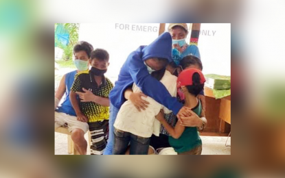 <p><strong>REUNITED.</strong> A New People's Army couple is reunited with their children after two years, at the headquarters of the Army's 27th Infantry Battalion in Barangay Dalisay, Panabo City, Davao del Norte, on Thursday (Nov. 5, 2020). Sara Sausa and husband Jose were captured in a firefight with government forces in a hinterland area in Davao City last September. <em>(Photo courtesy of Eastmincom)</em></p>