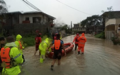 <p><strong>TO THE RESCUE.</strong> The QCDRRMO search and rescue team conducts rescue operations for several residents that were stranded in Vista Real in Barangay Batasan Hills on Thursday (Nov. 12, 2020) QCDRRMO head Mike Marasigan reminded residents to stay on guard even as the weather has started to improve. <em>(Photo grabbed from QCDRRMO FB page)</em></p>