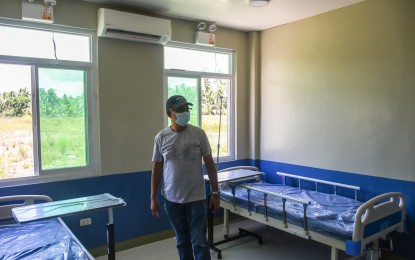 <p><strong>NEW HOSPITAL</strong>. Mayor Jose Ivan Dayan Agda of Borongan City inspects its 28-bed modern isolation facility in Campesao village in this undated photo. Agda on Thursday (Nov. 12, 2020) said they are planning to upgrade the health facility to a 50-bed hospital with the increasing need for better health care services amid the coronavirus pandemic. <em>(Photo courtesy of Borongan City government)</em></p>
