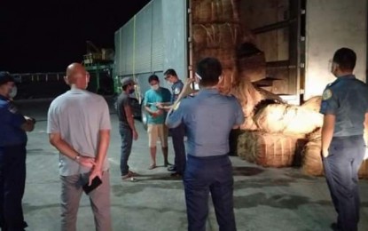 <p><strong>HOT LOGS.</strong> At least 5,000 board feet of Magkuno lumber worth PHP300,000 are intercepted by authorities in the port area in Surigao City on Wednesday evening, Nov. 11, 2020. Authorities arrested two suspects. (<em>Photo courtesy of PRO-13 Information Office)</em></p>