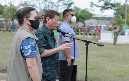 <p><strong>PRRD IN CAGAYAN.</strong> President Rodrigo Roa Duterte interacts with the families affected by Typhoon Ulysses in Barangay Iraga, Solana, Cagayan following an aerial survey of severely affected areas on Nov. 15, 2020.  He was accompanied by Senator Christopher Go.<em> (Presidential photo by Ace Morandante)</em></p>
<p> </p>