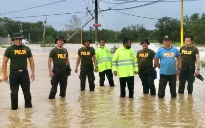 <p><strong>FLOOD HEROES</strong>. Personnel of the San Rafael Municipal Police Station, who rescued residents trapped in their houses including a day-old baby, in Barangay Maasim of the town in Bulacan at the height of Typhoon Ulysses on Nov. 12, 2020. They were among the 6,869 police personnel who were deployed for search and rescue operations as part of the Philippine National Police’s swift disaster response in affected areas. <em>(Photo by San Rafael MPS)</em></p>