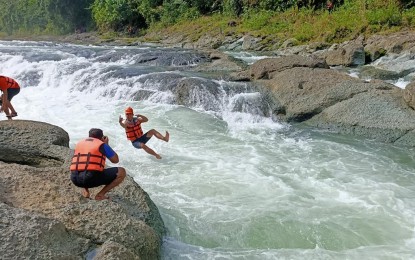 <p><strong>BACK IN BUSINESS</strong>. Undated photo of tourists at the Ulot River in Paranas, Samar, which officially opened to locals on Nov. 14, 2020. The Department of Tourism on Tuesday (Nov. 17, 2020) said at least 26 local government units in Eastern Visayas have opened their tourism industry under the new normal as the country reels from the coronavirus health crisis. <em>(PNA photo by Roel Amazona)</em></p>