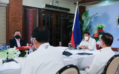 <p><strong>BEST BARGAIN</strong>. President Rodrigo R. Duterte presides over a meeting with the Inter-Agency Task Force on the Emerging Infectious Diseases (IATF-EID) core members before his talk to the people at the Malago Clubhouse in Malacañang Park, Manila on Tuesday night (Nov. 17, 2020). Duterte said the government must get the "best bargain" for the country's supply of coronavirus disease vaccines once available. <em>(Presidential photo by Alfred Frias)</em></p>