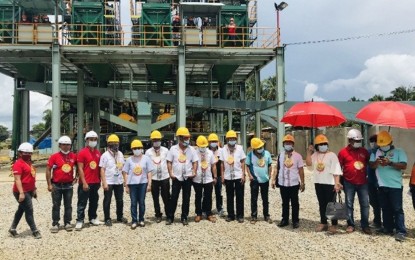 <p><strong>BLACK SAND MINING</strong>. The MacArthur Iron Sand Project Corp. inaugurates its dredger and magnetic separator plant in MacArthur, Leyte in this photo taken on Sept. 28, 2020. The firm on Friday (Nov. 20, 2020) assured residents of MacArthur town that they would be responsible in their business operations. <em>(Photo courtesy of Mines and Geosciences Bureau)</em></p>