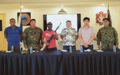 <p><br /><br /><strong>SURRENDERER.</strong> A member of the Sulu-based Abu Sayyaf Group (ASG), Al-Habi Jundam (3rd from left), surrenders and turns over a Garand rifle to troops of the Joint Task Force Tawi-Tawi on Friday (Nov. 20, 2020). Jundam said he surrendered because he feared for his life.<em> (Photo courtesy of Joint Task Force Tawi-Tawi)</em></p>