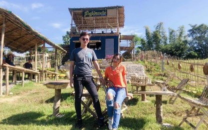 <p><strong>HIGHLANDS CAFE IN THE SKY.</strong> Harold Keith Recede (left) and Angeline Asaytono Gali (right), both millennials and the owners of the trending Highland Cafe in the Sky at Barangay Lipit Tomeeng San Fabian town Pangasinan, pose in front of their cafe. The cafe offers a scenic view and delicious food while providing livelihood to college students from the barangay. <em>(Photo courtesy of Highlands Cafe in the Sky) </em></p>