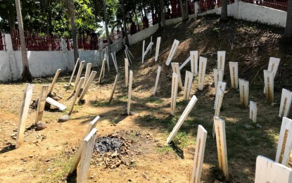 <p><span lang="EN-US"><strong>FULL JUSTICE.</strong> Photo shows the headstones bearing the names of the 58 people, including 32 media workers, who were killed in the grisly Nov. 23, 2009 Ampatuan massacre at the same site in Sitio Masalay, Barangay Salman in Ampatuan, Maguindanao. The families of the victims vow to continue their quest for justice. (<em>PNA GenSan photo)</em></span></p>