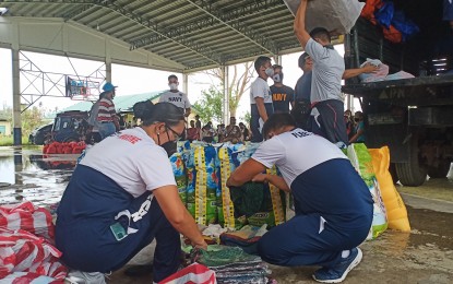 <p><strong>RELIEF AID.</strong> Navy personnel from the Civil-Military Operations Unit-Southern Luzon distribute relief goods to Aetas in Buhi, Camarines Sur on Monday (Nov. 23, 2020). Some 4,000 Aetas from 28 communities in the town who were affected by the recent typhoons benefited from the relief drive. <em>(Photo courtesy of Naval Forces Southern Luzon)</em></p>