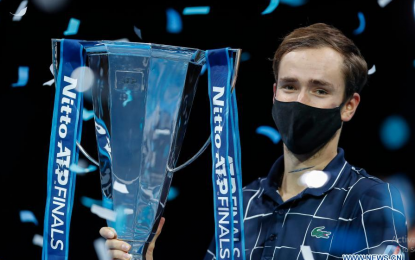 <p><strong>FIRST ATP FINALS WIN</strong>. Daniil Medvedev of Russia poses with his trophy during the awarding ceremony for the singles final against Dominic Thiem of Austria at the ATP World Tour Finals 2020 in London, Britain on Nov. 22, 2020. It was Medvedev’s first ATP Finals victory. <em>(Xinhua/Han Yan)</em></p>