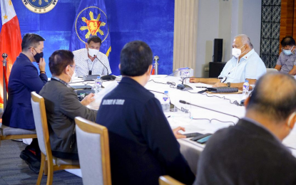 <p><strong>CALAMITY FUNDS</strong>. President Rodrigo R. Duterte presides over a meeting with the Inter-Agency Task Force on the Emerging Infectious Diseases (IATF-EID) core members before his talk to the people at the Arcadia Active Lifestyle Center in Davao City on Nov. 23, 2020. Malacañang on Tuesday said Duterte approved additional PHP1.5 billion to augment calamity funds of the local government units badly hit by Typhoon Ulysses. <em>(Presidential photo by Joey Dalumpines)</em></p>