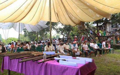 <p><strong>MASS SURRENDER.</strong> Around 278 underground mass organization members and 34 members of the Milisya ng Bayan of the communist New People's Army yield to the Army's 23rd Infantry Battalion during a mass surrender ceremony on Tuesday (Nov. 24, 2020) in Barangay Camagong, Nasipit, Agusan del Norte. Military officials assure the villagers of the government's sustained support. <em>(Photo courtesy of 23IB)</em></p>