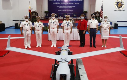 <p><strong>DRONE TURNOVER.</strong> Philippine Navy officials led by Vice Adm. Giovanni Carlo Bacordo (center) and US Embassy in Manila Deputy Chief of Mission Kimberly Kelly (3rd from right) lead the turnover ceremony for the Insitu Inc. ScanEagle unmanned aerial system (UAS) at the Naval Base Heracleo Alano, Sangley Point, Cavite on Wednesday (Nov. 25, 2020). The ScanEagle and its associated equipment, worth USD14.79 million, were acquired by the Philippines through the Maritime Security Initiative Program of the United States. <em>(Photo courtesy of Naval Public Affairs Office)</em></p>