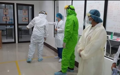 <p><strong>MANAGING THE DISEASE</strong>. Health workers inside the Eastern Visayas Regional Covid-19 Testing Center in Tacloban City in this May 14, 2020 photo. The Philippine Health Insurance Corporation has just paid over PHP1 million so far for the management of coronavirus disease 2019 (Covid-19) cases in the region. <em>(Photo courtesy of Eastern Visayas Regional Medical Center)</em></p>