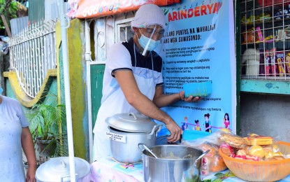 <p><strong>RESTARTING BUSINESS</strong>. Jessie Seno, a food stall owner in Quezon City, is one of the micro-entrepreneurs who was able to revive his livelihood through Project Karinderya. Through Project Karinderya, Seno's food stall serves vulnerable families in their community.<em> (Photo courtesy of Project Karinderya)</em></p>