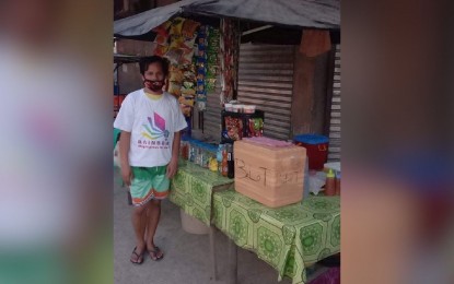 <p>Hector Tomas used the money from the “Rainbow <em>Magnegosyo Ta Day</em>” program to put up a makeshift store that sells soft drinks, coffee, candies, noodles, and <em>ballot. (Contributed photo)</em></p>
<p> </p>