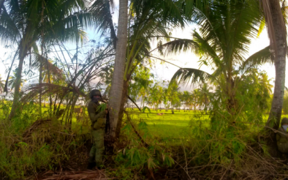 <p><strong>SECURING THE PERIMETER.</strong> Two members of the Army’s 40th Infantry Battalion take cover during a law enforcement operation against armed lawless elements on Tuesday morning (Dec. 1, 20202) in Sultan sa Barongis, Maguindanao. While the suspects eluded arrest, government forces found in their safe house assorted high-powered guns. <em>(Photo courtesy of 40IB)</em></p>