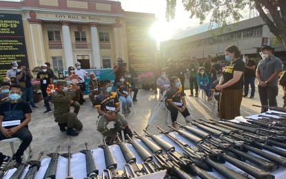 <p><strong>RETURNING TO THE LAW.</strong> Davao City Mayor Sara Z. Duterte (2nd from right) speaks with former New People's Army rebels Tuesday afternoon (Dec. 1, 2020) and assures them of government assistance. The 11 surrenderers turned over 34 firearms and four improvised explosive devices. <em>(PNA photo by Che Palicte)</em></p>