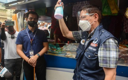 <p><strong>INSPECTION.</strong> Manila Mayor Francisco 'Isko Moreno' Domagoso (left) and Health Secretary Francisco Duque III (right) inspect the Divisoria market on Thursday (Dec. 3, 2020). The two officials reminded the public that Covid-19 is still in the country and that everyone must continue to follow minimum public health safety protocols. <em>(Photo grabbed from Isko Moreno Domagoso FB page)</em></p>