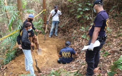 <p><strong>SKELETAL REMAINS</strong>. Scene of the crime operatives of the police process the burial site in Sitio Aguntilang 3, Barangay Riverside in Isabela, Negros Occidental, where they exhumed the skeletal remains of New People’s Army rebel Randy Garsola on Nov. 30, 2020. Garsola was killed by his comrades in October 2018 after he manifested the intention to surrender, a former rebel said. <em>(Photo courtesy of 303rd Infantry Brigade, Philippine Army)</em></p>
