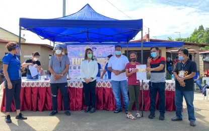 <p><strong>HOMES FOR 'PABLO' VICTIMS.</strong> The National Housing Authority in Region 11 (NHA-11) turns over Transfer Certificates of Titles to some 1,485 family-beneficiaries and representatives of Tropical Storm Pablo Resettlement Housing Projects in Monkayo, Davao de Oro on Wednesday (Dec. 2, 2020). The province of Davao de Oro, formerly known as Compostela Valley, was among the hardest-hit areas by Tropical Storm Pablo, which pummeled areas in Mindanao in December 2012. <em>(Photo courtesy of NHA-11)</em></p>