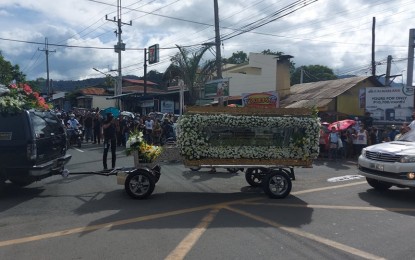 <p><strong>SLAIN MAYOR</strong>. The remains of slain Los Baños mayor Caesar Perez were transferred from his residence to the municipal hall in Los Baños, Laguna on Tuesday (Dec. 8, 2020). Perez’s youngest son, Aldous is happy that President Rodrigo Duterte apologized for the inclusion of his father in the so-called "narco-list", and believes the President can help them in their quest for justice. <em>(PNA photo by Ivan Stewart Saldajeno)</em></p>