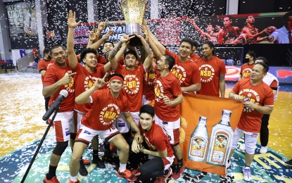 <p><strong>CHAMPS.</strong> Ginebra players hoist the PBA Philippine Cup championship trophy after clinching it on Dec. 9, 2020 at the Angeles University Foundation Sports and Cultural Center in Pampanga. LA Tenorio is named the Finals Most Valuable Player.<em> (Photo courtesy of PBA Images)</em></p>