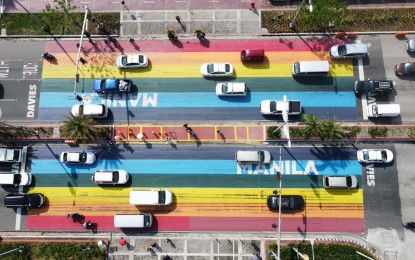<p><strong>'RAINBOW' CROSSING.</strong> The rainbow-colored pedestrian crosswalk in front of Plaza Rajah Sulayman along Roxas Boulevard in Manila. The painting striped in colors evoke the gay pride flags, an appreciation for the LGBTQ (lesbian, gay, bisexual, transgender, and queer) community and their contributions to society, Manila Mayor Francisco "Isko Moreno" Domagoso said. <em>(Photo courtesy of Manila PIO)</em></p>