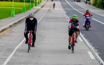 <p><strong>REDISCOVERING BIKING</strong>. Bikers traverse a highway in Leyte province in this September 2020 photo. The health department on Wednesday (Dec. 9, 2020) again encouraged the public to rediscover biking as a hobby and means of transportation to keep healthy and help the environment at a time where public transport operations are still limited.<em> (Photo courtesy of Vice Governor Carlo Loreto)</em></p>