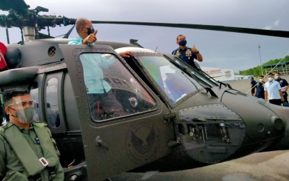 <p><strong>COMBAT CHOPPERS.</strong> Defense Secretary Delfin Lorenzana (left) and PAF chief, Lt. Gen. Allen Paredes (right) lead the acceptance ceremony for the first six S-70i "Black Hawk" combat helicopters for the Philippine Air Force at the Clark Air Base, Angeles City, Pampanga on Thursday (Dec. 10, 2020). The remaining 10 of a total of 16 helicopters acquired by the DND from Poland are set to be delivered to the country next year. <em>(Photo courtesy of DND Defense Communications Service)</em></p>