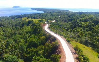 <p><strong>NEW ACCESS ROAD</strong>. The aerial photo shows the newly-completed PHP22.6-million access road leading to Anas hill view deck in Padre Burgos, Southern Leyte. The Department of Public Works and Highways (DPWH) on Thursday (Dec. 10, 2020) said the project involved concreting nearly one kilometer stretch of the two-lane road. <em>(Photo courtesy of DPWH)</em></p>